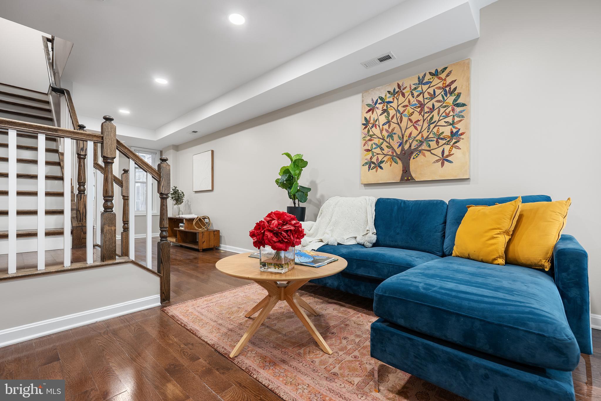 1358 Towson Street Baltimore, MD 21230 - Photo 4 of 39 a living room with furniture and flowers