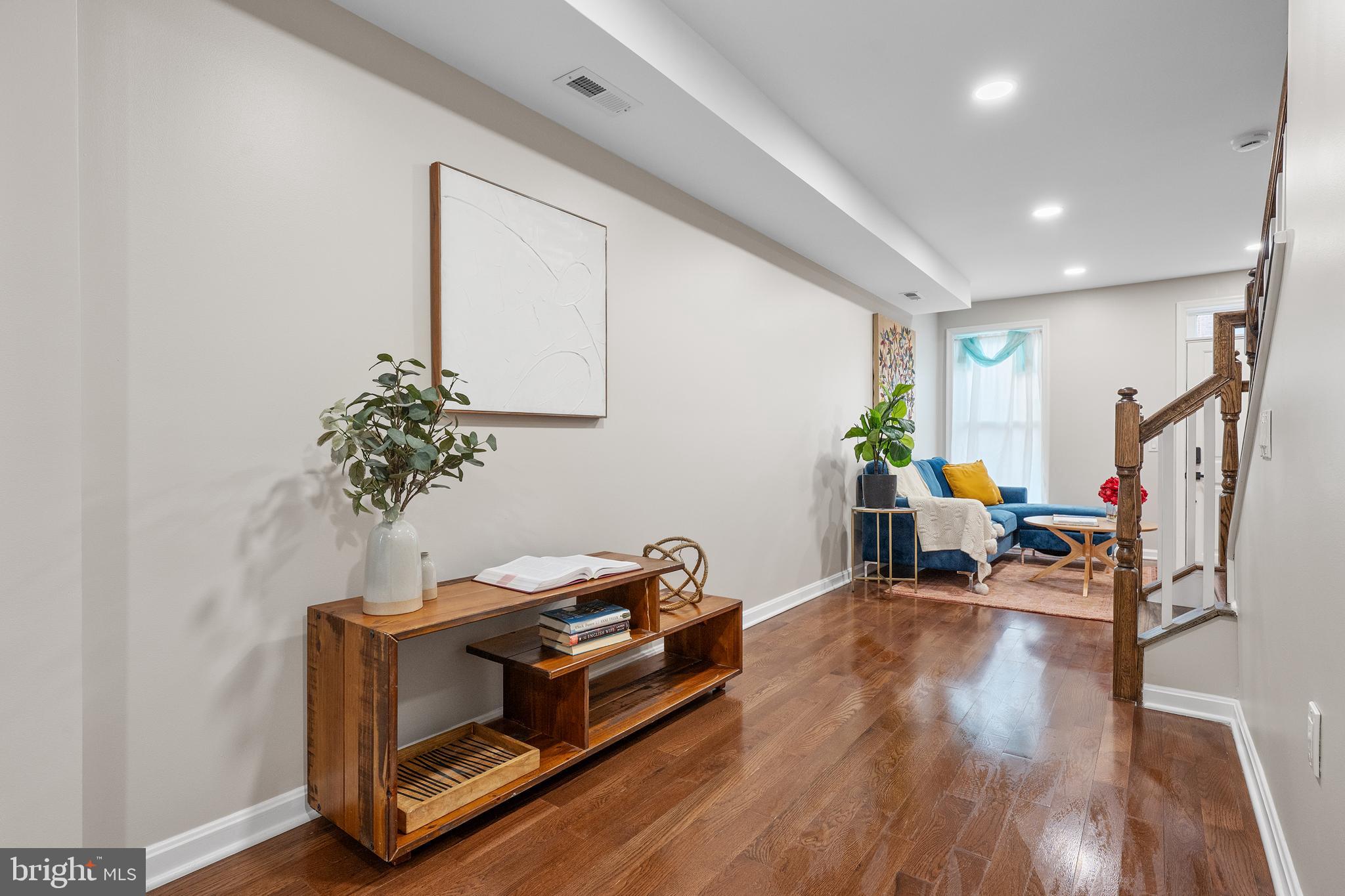 1358 Towson Street Baltimore, MD 21230 - Photo 5 of 39 a living room with furniture and a potted plant
