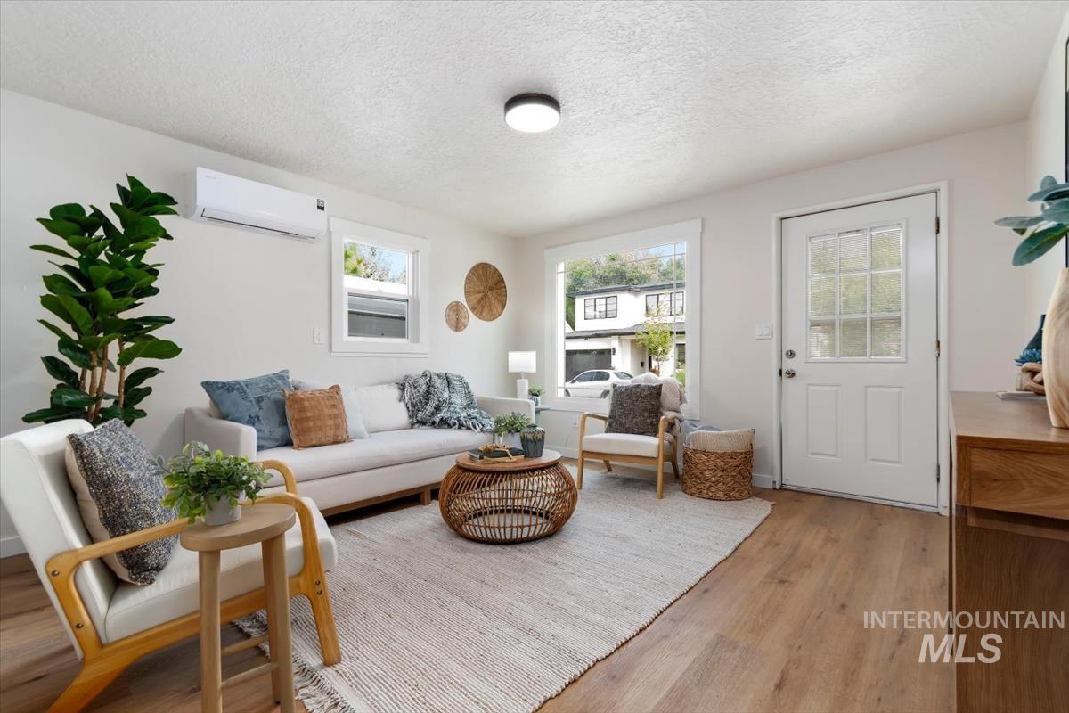 3005 West Hester Street Boise, ID 83702 - Photo 7 of 32 Living area featuring wood-finish flooring, white walls, and recessed lighting
