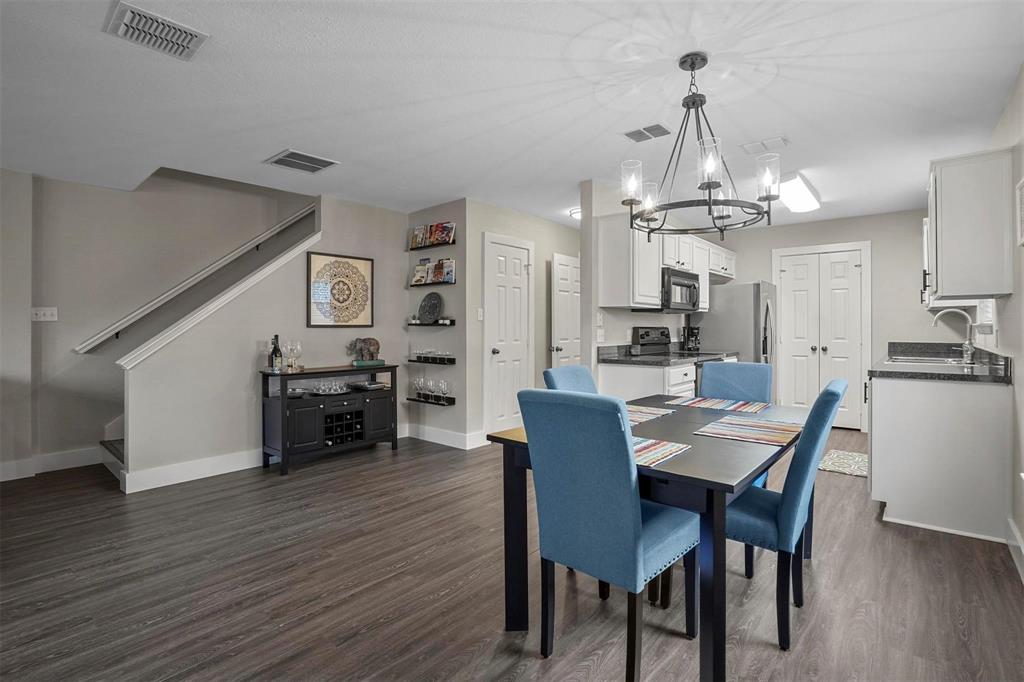 5113 Mountain Spring Trail Fort Worth, TX 76123 - Photo 5 of 35 a view of a dining room with furniture and wooden floor