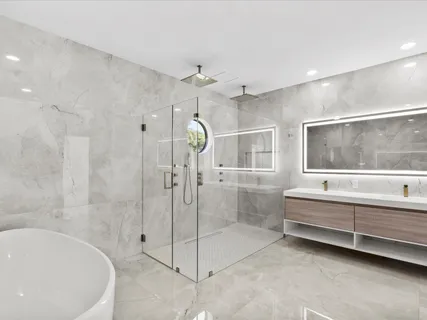 a spacious bathroom with a bathtub and a shower