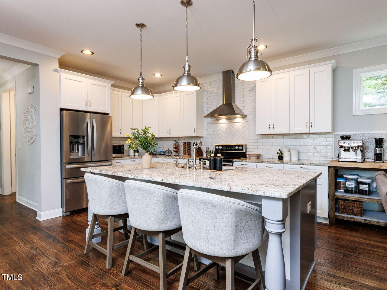 802 Lynn Road Durham, NC 27703 - Photo 6 of 41 Chef inspired white Kitchen with oversized island, perfect for gathering. Exquisite lighting, custom cabinets, ss appliances, built-in coffee station.