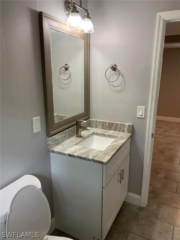 4513 Luckett Road Fort Myers, FL 33905 - Photo 15 of 20 a bathroom with a granite countertop sink and a mirror