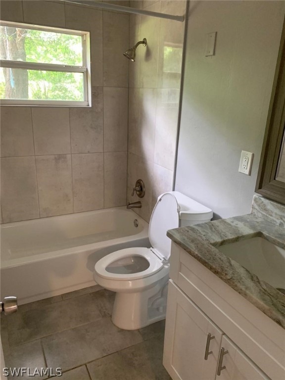 4513 Luckett Road Fort Myers, FL 33905 - Photo 16 of 20 a bathroom with a granite countertop sink a toilet and bathtub