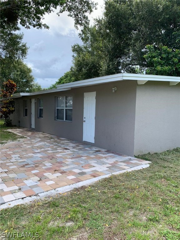 4513 Luckett Road Fort Myers, FL 33905 - Photo 20 of 20 a backyard of a house with lots of green space and outdoor seating