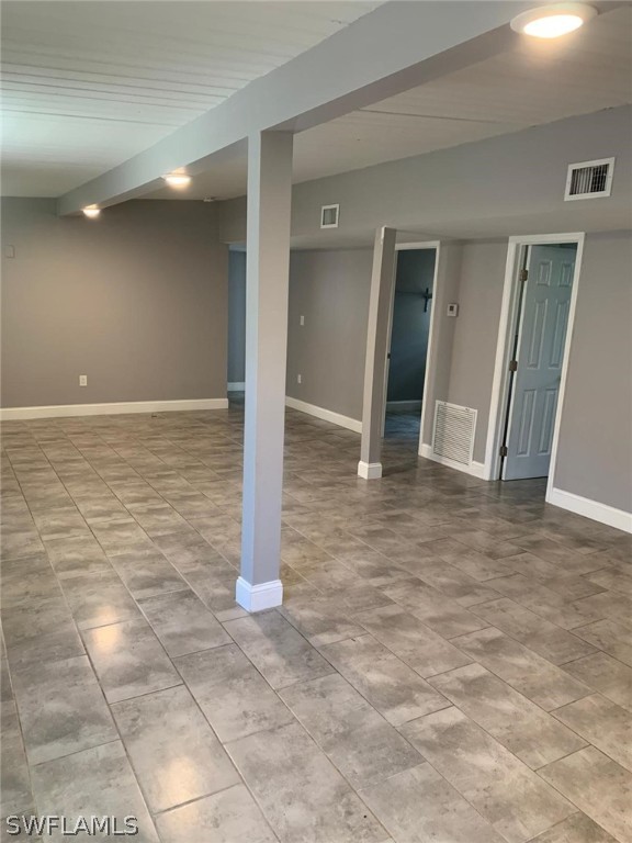 4513 Luckett Road Fort Myers, FL 33905 - Photo 10 of 20 a view of a hall with wooden floor