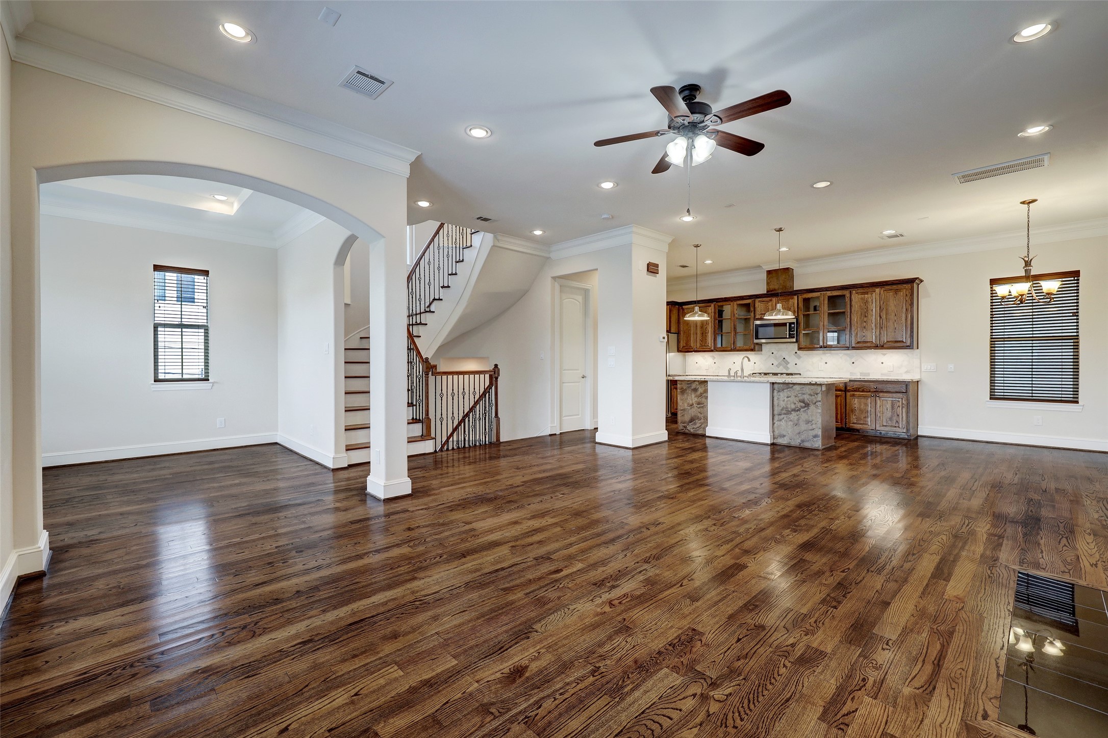 2401 Radcliffe Street Houston, TX 77007 - Photo 6 of 19 Another view of this fantastic living. It's just inviting you to relax, unwind, and enjoy time with friends, family, and roommates. Aren't those wood floors just showing off?