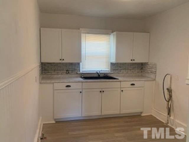 1704 Robinhood Road Durham, NC 27701 - Photo 2 of 18 a close view of kitchen with granite countertop cabinets