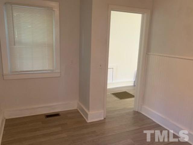 1704 Robinhood Road Durham, NC 27701 - Photo 16 of 18 a view of empty room with wooden floor