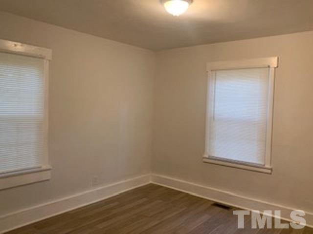 1704 Robinhood Road Durham, NC 27701 - Photo 7 of 18 a view of a small space with wooden floor and a window