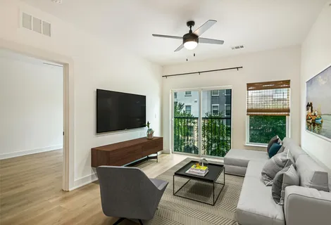 a living room with furniture and a flat screen tv