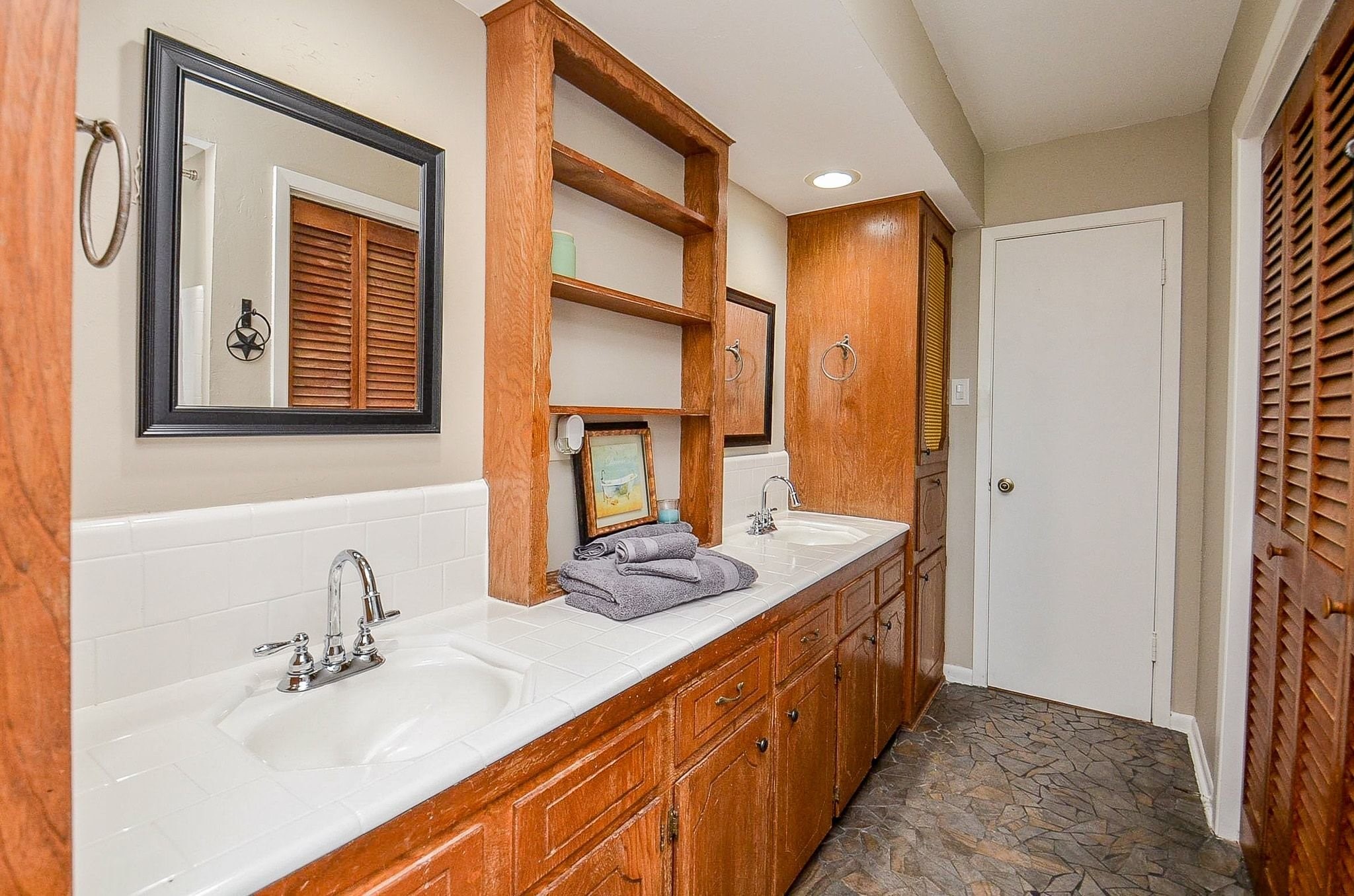 2500 County Road 62 Rosharon, TX 77583 - Photo 25 of 48 a bathroom with a double vanity sink and a mirror