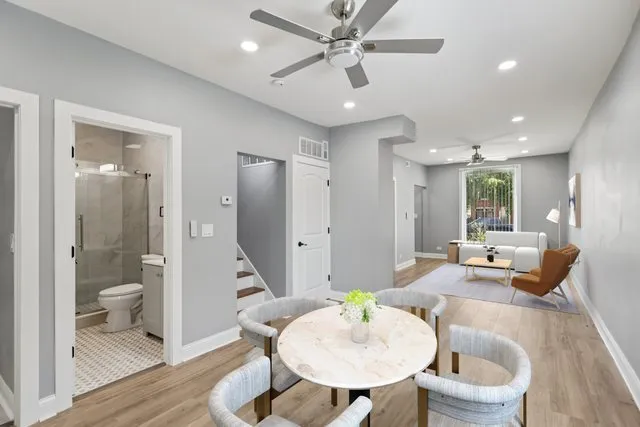 a living room with a couch and a chandelier