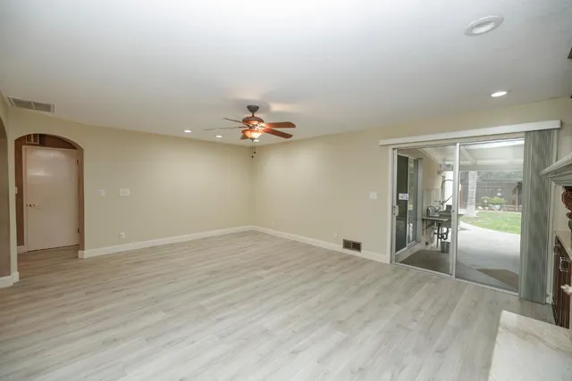 a kitchen with stainless steel appliances granite countertop wooden cabinets a stove top oven a sink and dishwasher