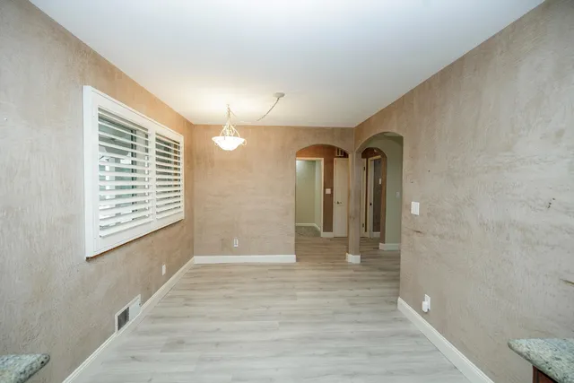 a kitchen with stainless steel appliances granite countertop wooden cabinets a sink and dishwasher