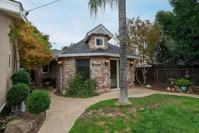 a front view of a house with garden