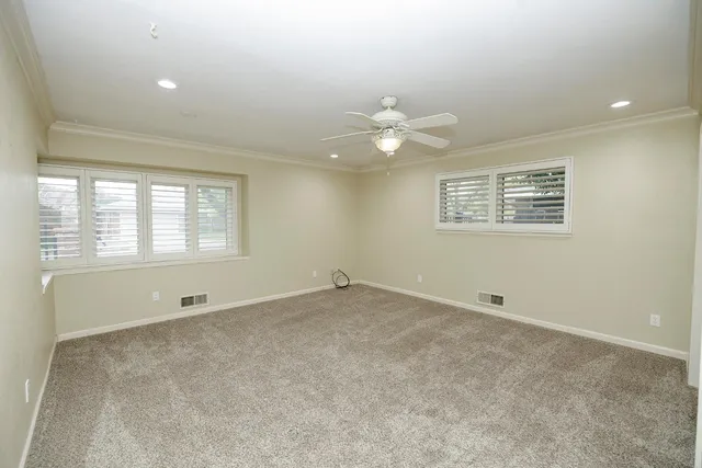 a spacious bathroom with a granite countertop sink mirror and toilet