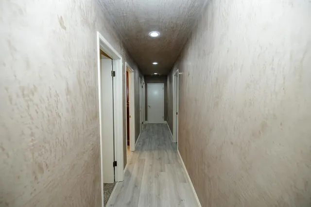 a bathroom with a sink a toilet and mirror