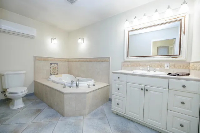 a bedroom with bed and a window