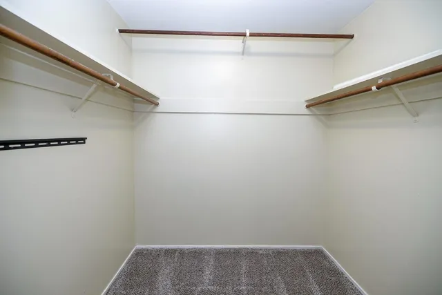 a bedroom with bed and a window