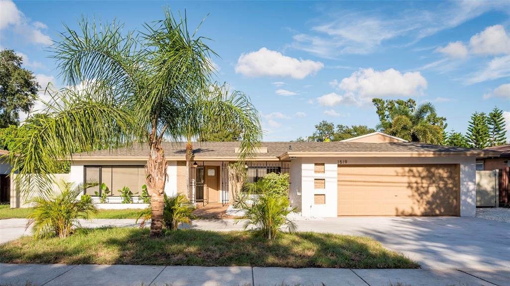 1519 South Keene Road Clearwater, FL 33756 - Photo 1 of 1 front view of a house with a yard