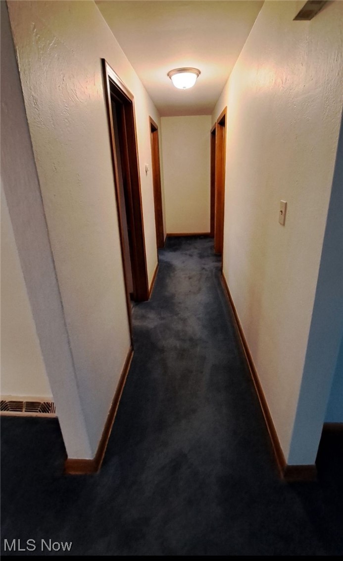 4735 New Road Youngstown, OH 44515 - Photo 11 of 36 Hall featuring dark carpet
