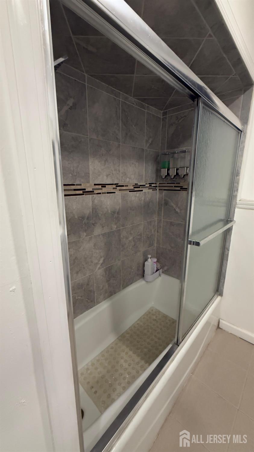 283 Washington Street Perth Amboy, NJ 08861 - Photo 12 of 15 a bathroom with a shower