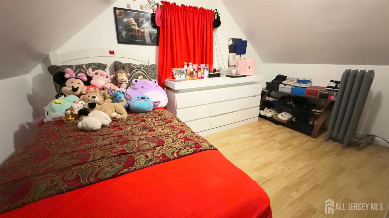283 Washington Street Perth Amboy, NJ 08861 - Photo 14 of 15 a bedroom with a bed and a dresser