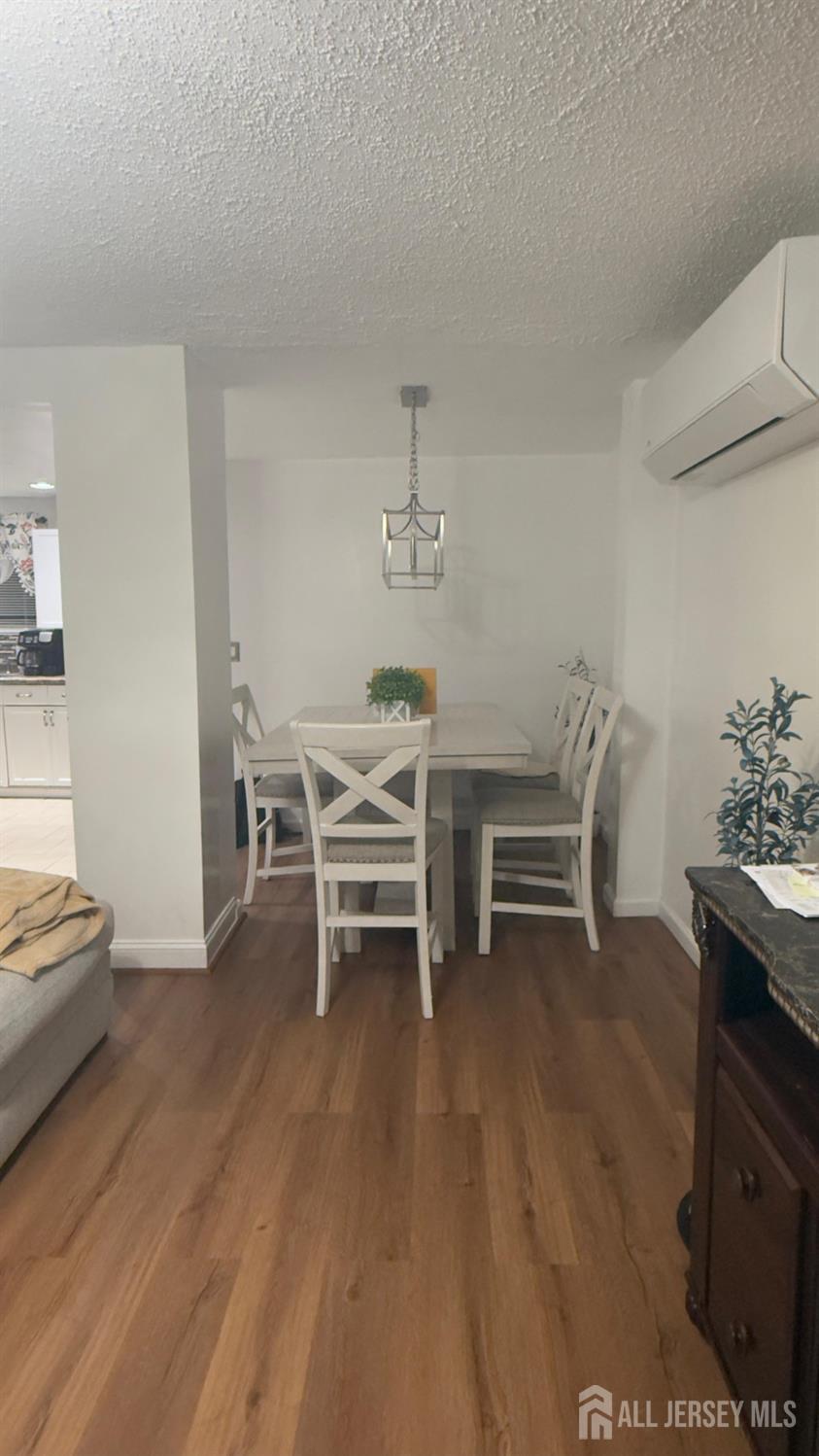 283 Washington Street Perth Amboy, NJ 08861 - Photo 3 of 15 a dining room with furniture and wooden floor
