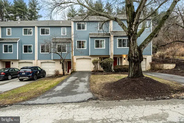 a view of a car park in front of a house