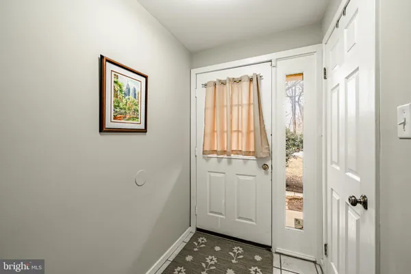 a view of front door with wooden floor