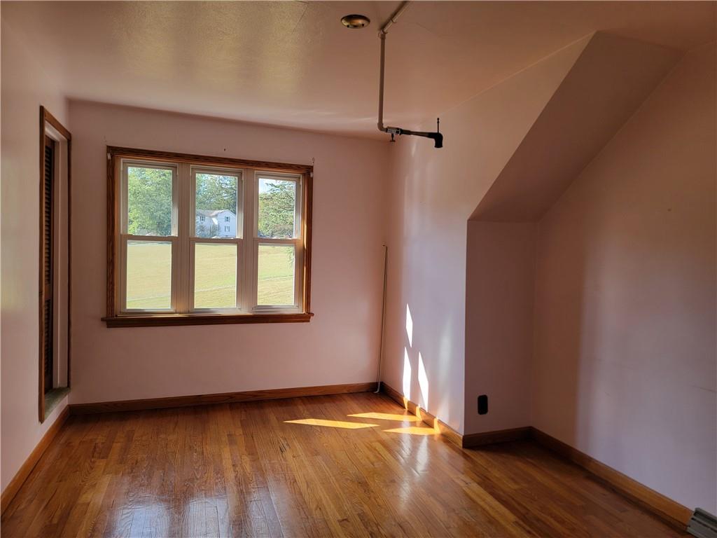 1480 Pollock Road Rossiter, PA 15772 - Photo 14 of 32 a view of an empty room with wooden floor and a window
