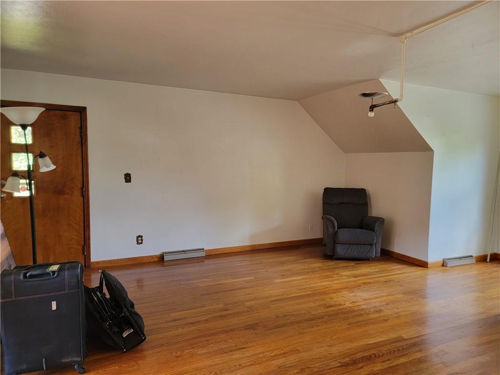 1480 Pollock Road Rossiter, PA 15772 - Photo 15 of 32 an empty room with wooden floor and windows