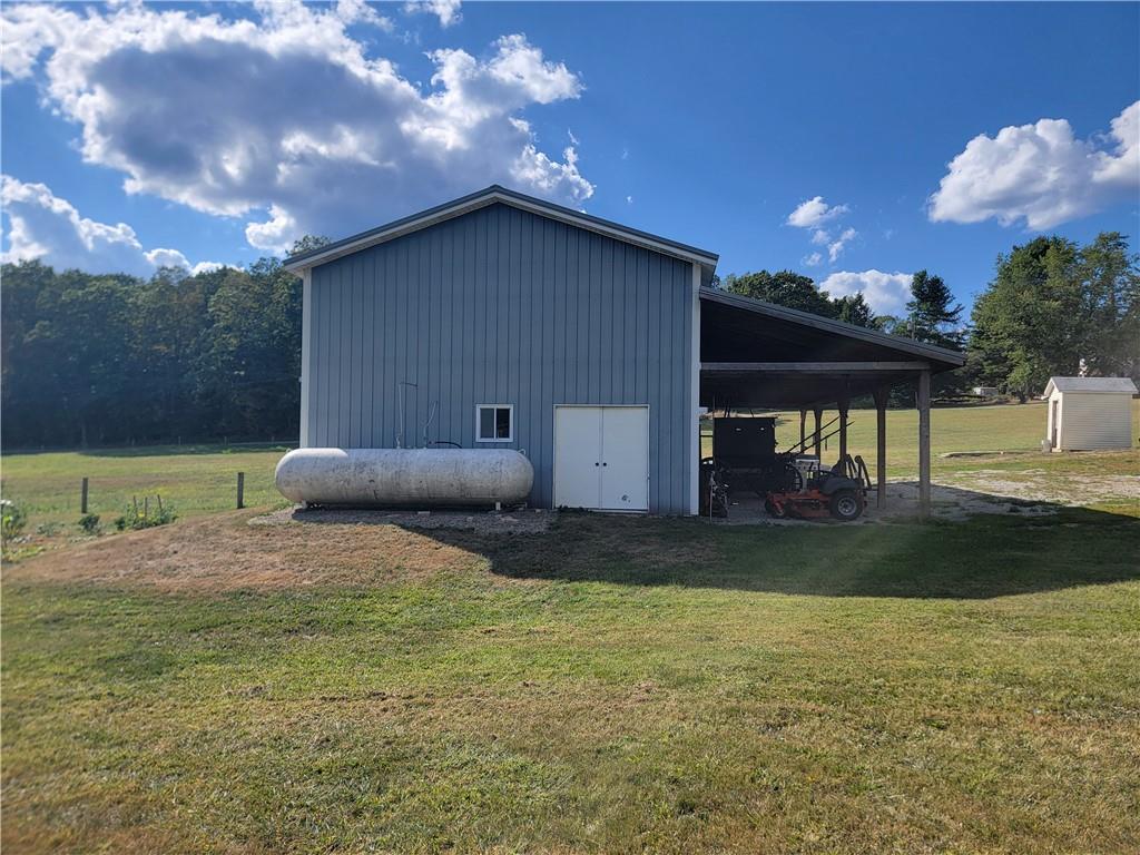 1480 Pollock Road Rossiter, PA 15772 - Photo 30 of 32 a backyard of a house with table and chairs