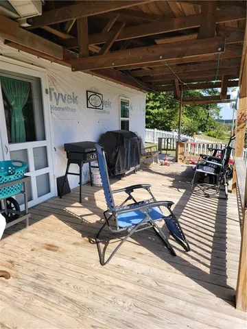 a view of a dinning table and chairs in the patio