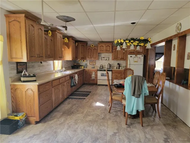 a kitchen with lots of counter top space and dining table