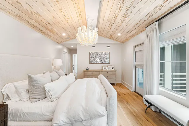 a bathroom with a sink a toilet and a large mirror