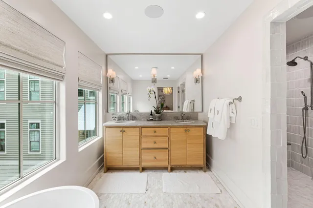 a bedroom with a large bed and a large window