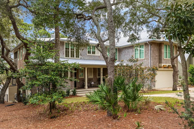 an aerial view of residential house with outdoor space and swimming pool
