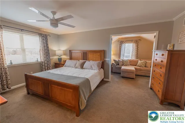 a bedroom with bed and window