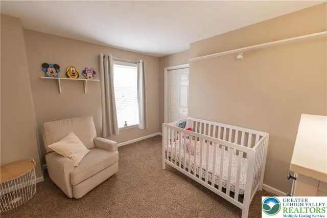 a bedroom with furniture and a window