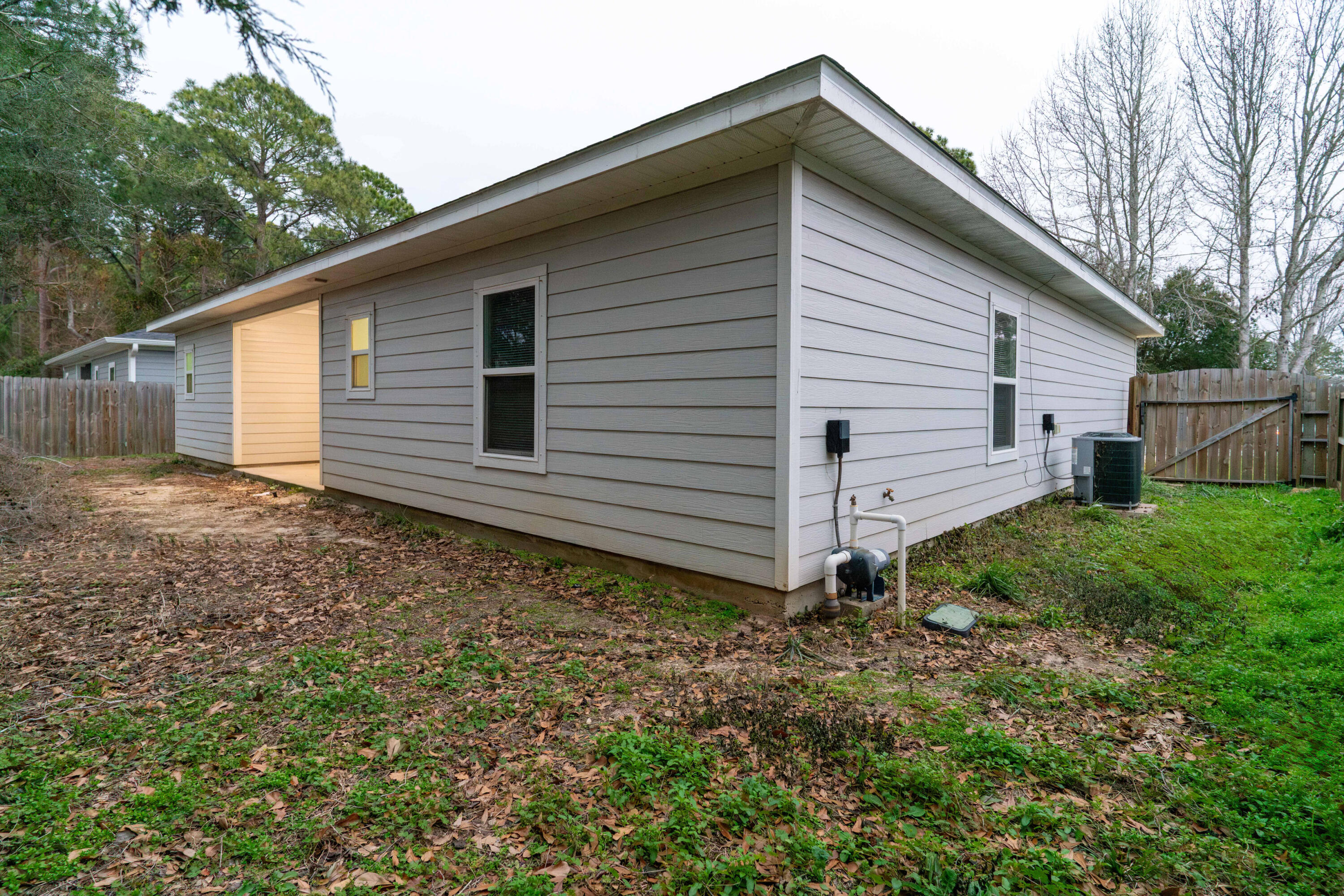 2243 Wind Trace Road North Navarre, FL 32566 - Photo 33 of 34 a view of a house with a yard
