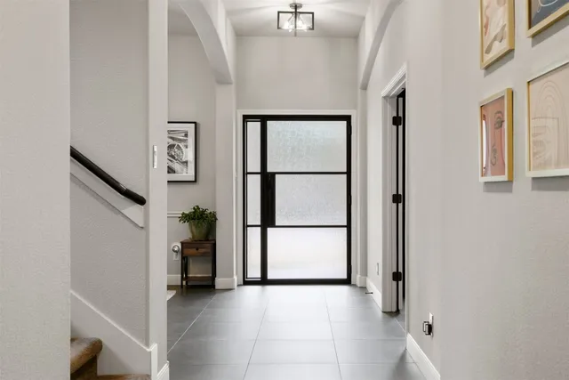 a view of an entryway with a hallway