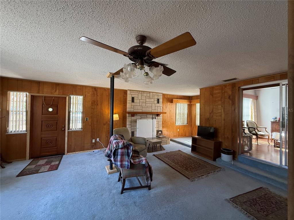 2200 Butler Street Leesburg, FL 34748 - Photo 11 of 32 a living room with furniture and a large window