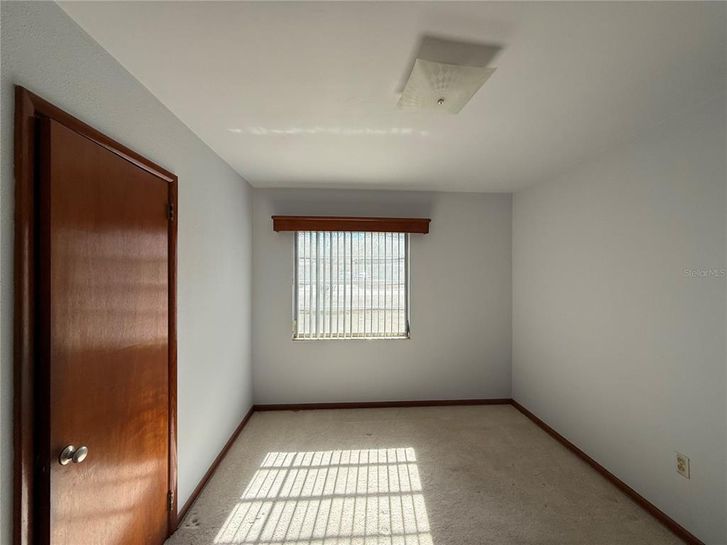 2200 Butler Street Leesburg, FL 34748 - Photo 16 of 32 an empty room with windows