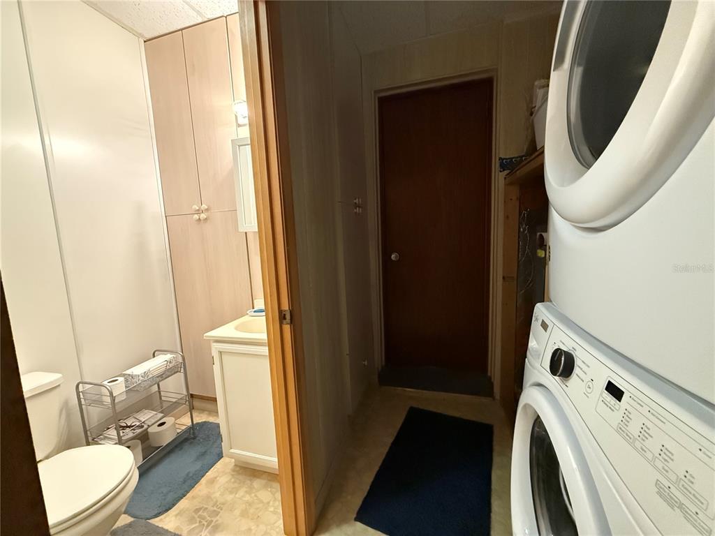 2200 Butler Street Leesburg, FL 34748 - Photo 22 of 32 a bathroom with a sink a toilet and shower curtain