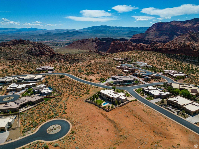 Basalt Cir Street, Unit 1027 St. George, UT 84770 - Photo 7 of 29 Aerial perspective of suburban area featuring a mountainous background