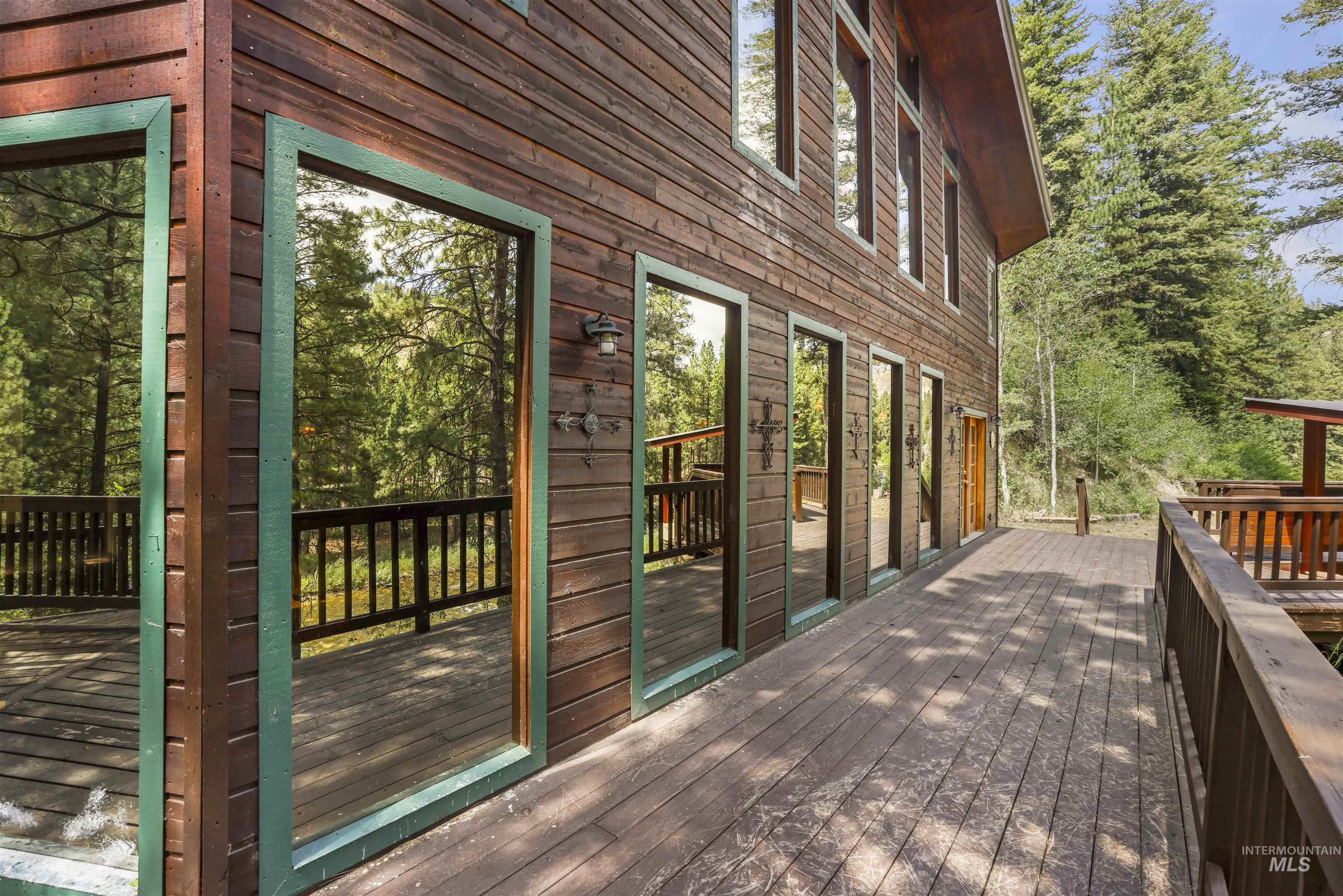 224 Dakota Road Mountain Home, ID 83647 - Photo 34 of 50 Expansive wood deck with a dark wood finish, extending along the side of the property