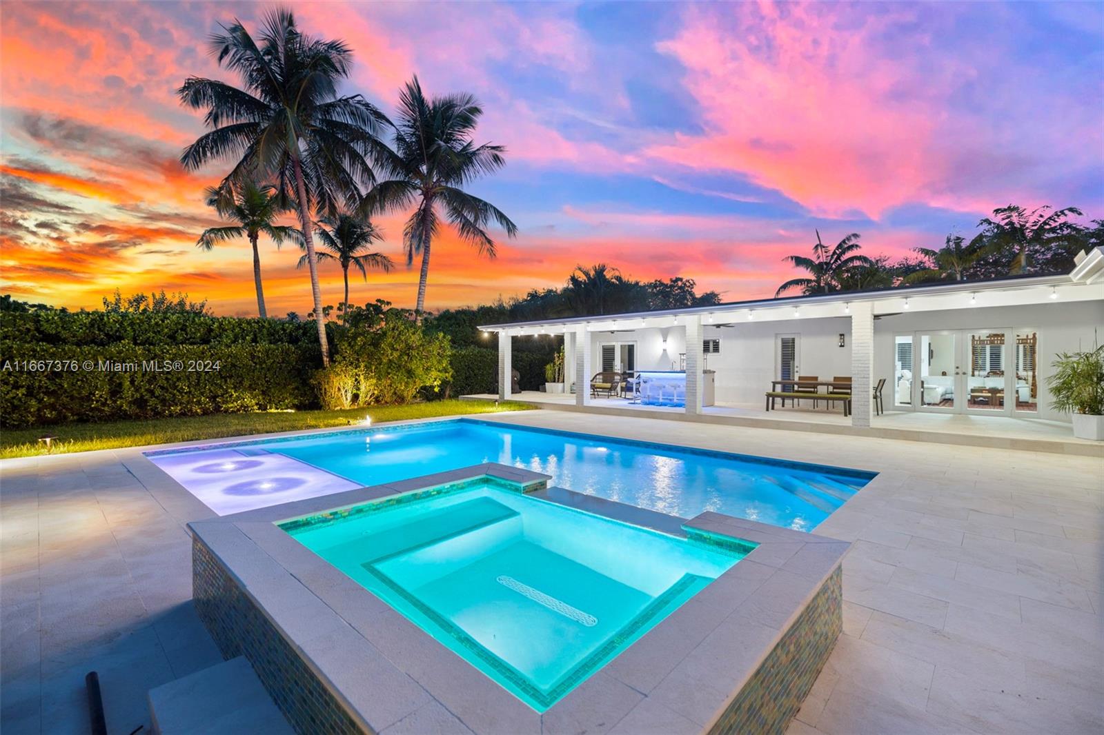 10005 Southwest 79th Avenue Miami, FL 33156 - Photo 1 of 32 a view of swimming pool with a lounge chair and palm trees
