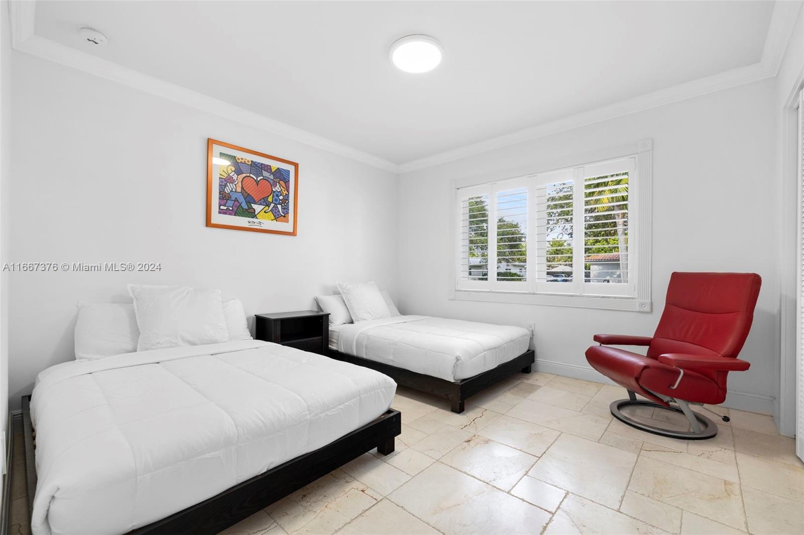 10005 Southwest 79th Avenue Miami, FL 33156 - Photo 15 of 32 a bedroom with two beds and a couch